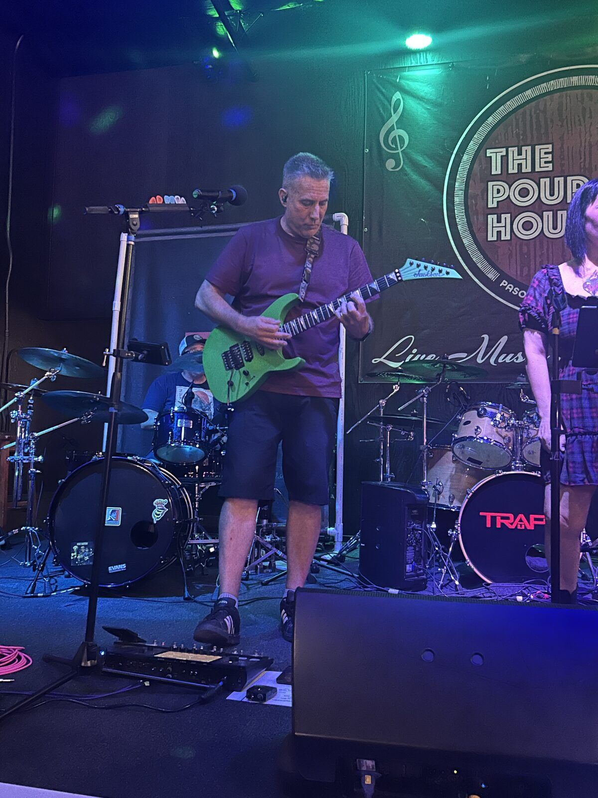your alternative at the pour house in paso robles, september 23, 2026: a guitarist playing beside the drum kit on the left side of the stage.